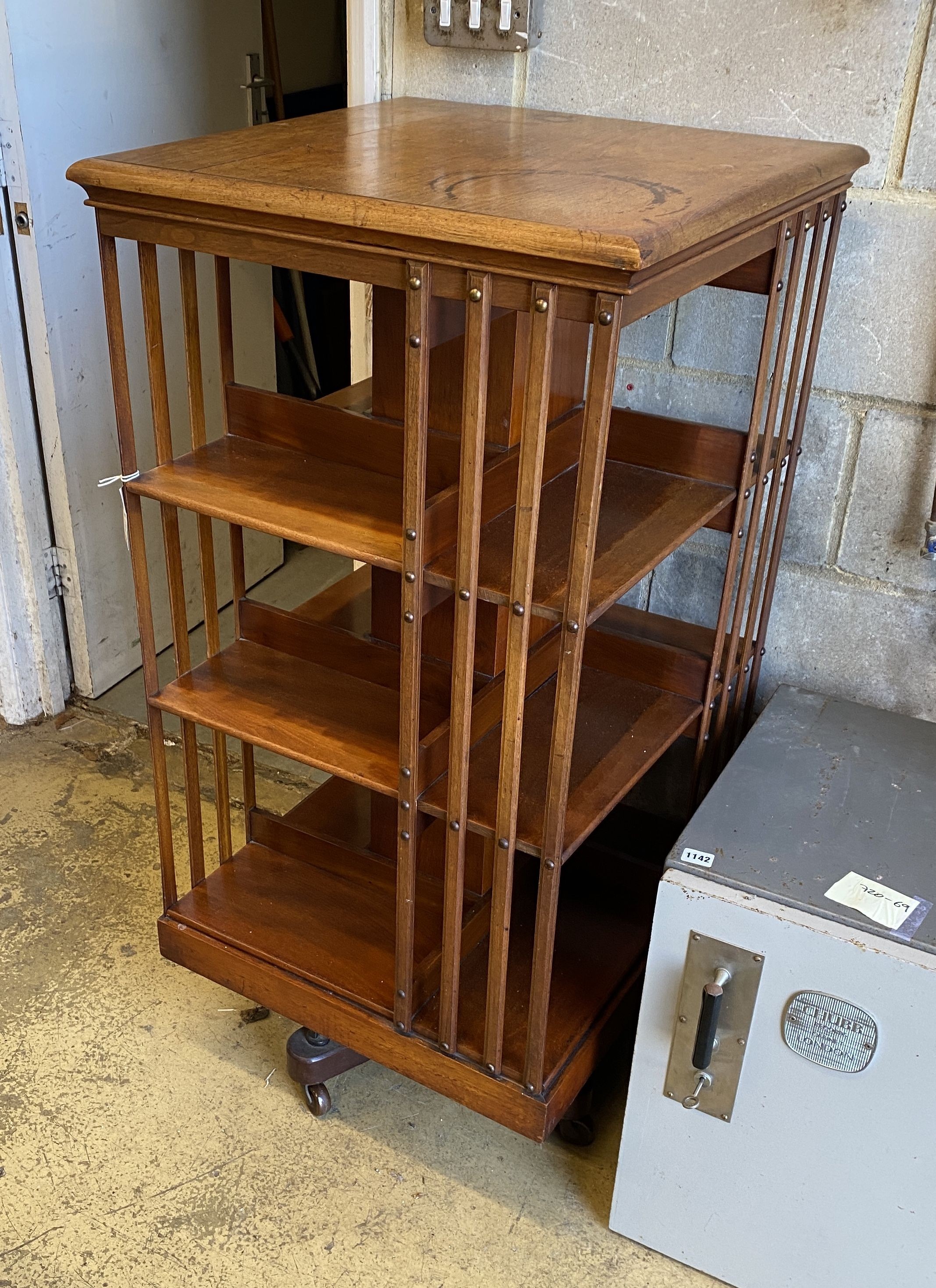 A large Edwardian pale oak revolving bookcase, width 59cm, depth 59cm, height 120cm
